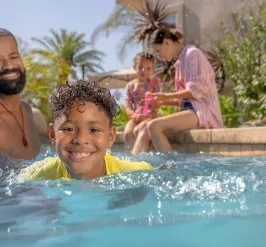 A family in the pool having fun at the Y