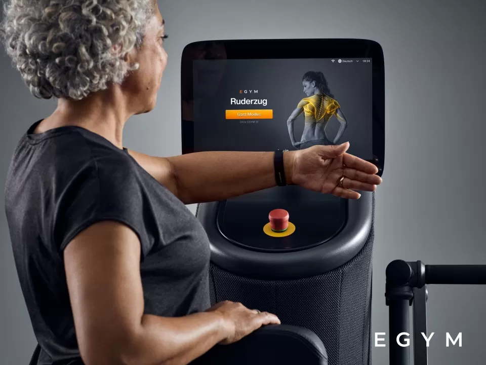 A lady using EGYM Equipment