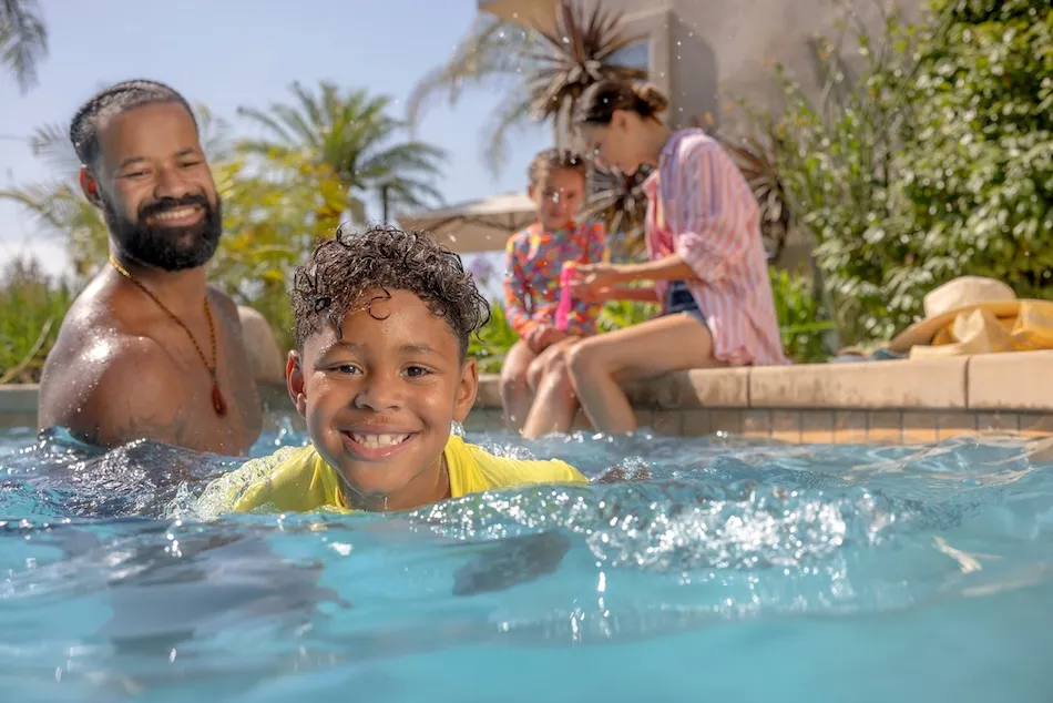 A family in the pool having fun at the Y