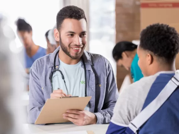 Young teen meeting with counselor for college