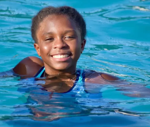 young girl enjoying swimming at the O.P. Schnabel Y outdoor pool