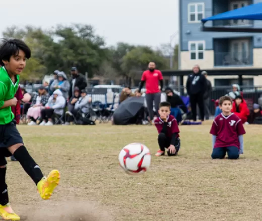 Boy playing soccer at the Y