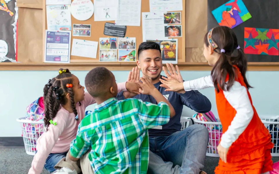 At the Y, we are for all! A group of YMCA Staff members pose for picture