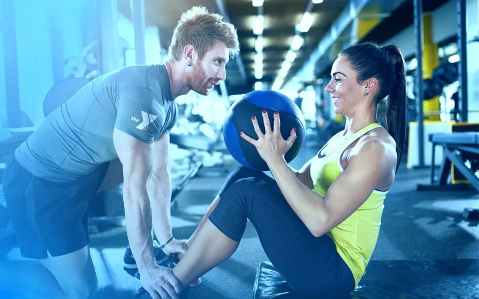YMCA Personal Trainer helping members reach their goals